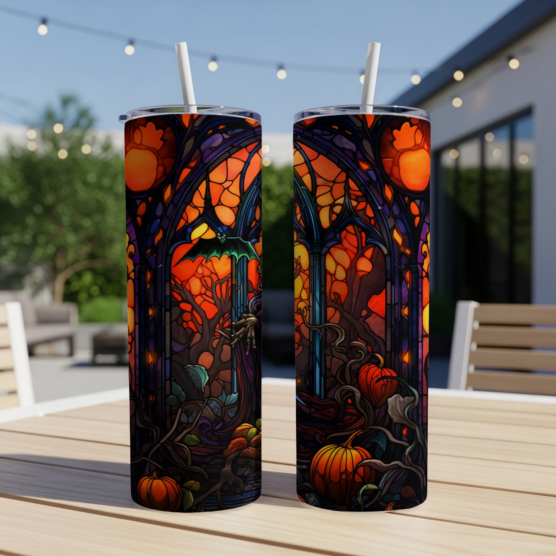 Halloween tumbler with stained-glass design of bats, pumpkins, and dark forest.