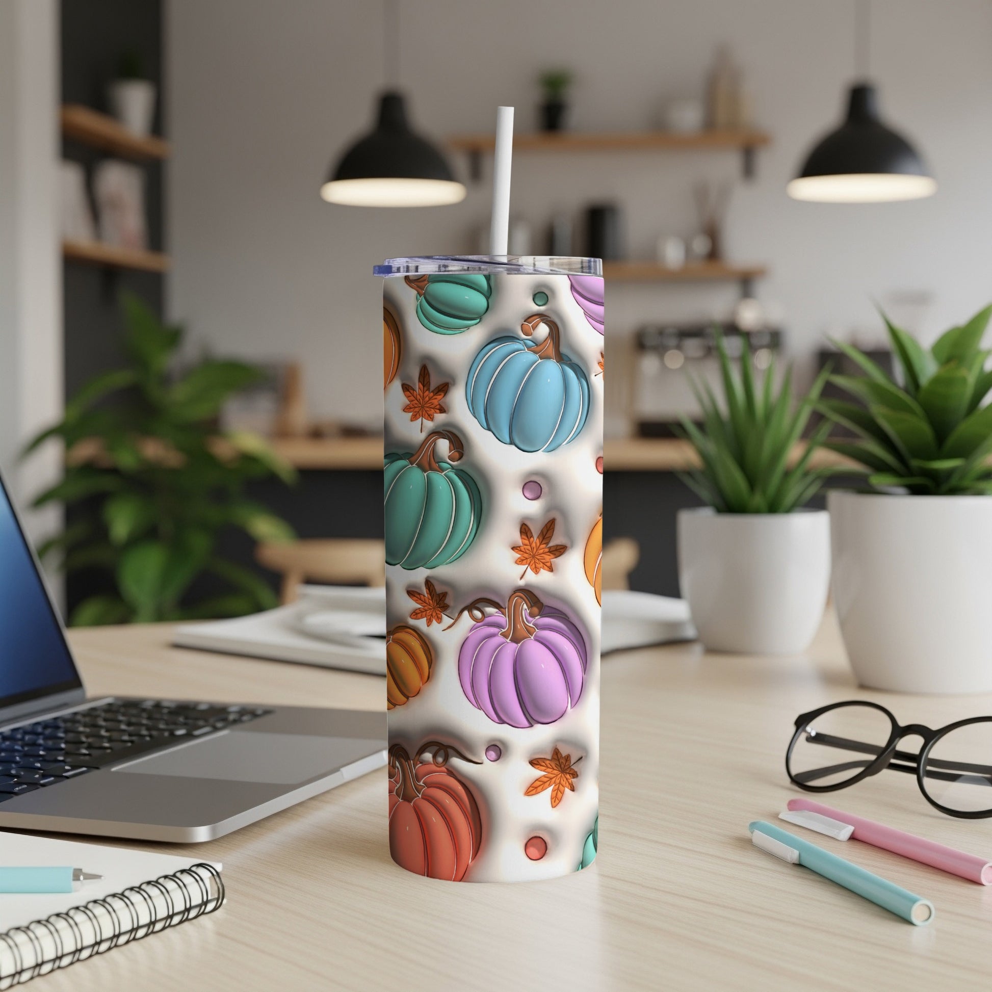 White tumbler with colorful pumpkins and autumn leaves pattern.