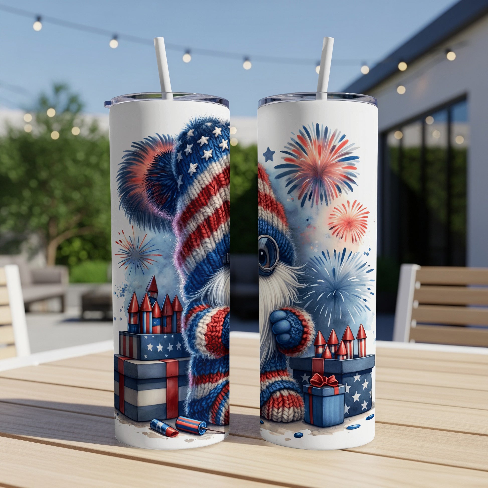 Two tumblers with a patriotic bear design, fireworks, and gift boxes.
