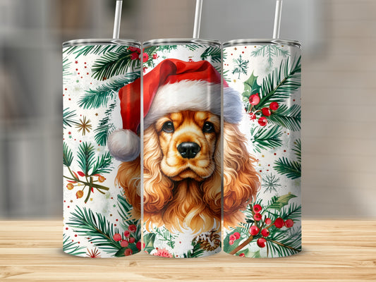 Dog wearing Santa hat with festive holly and berries design on tumblers.