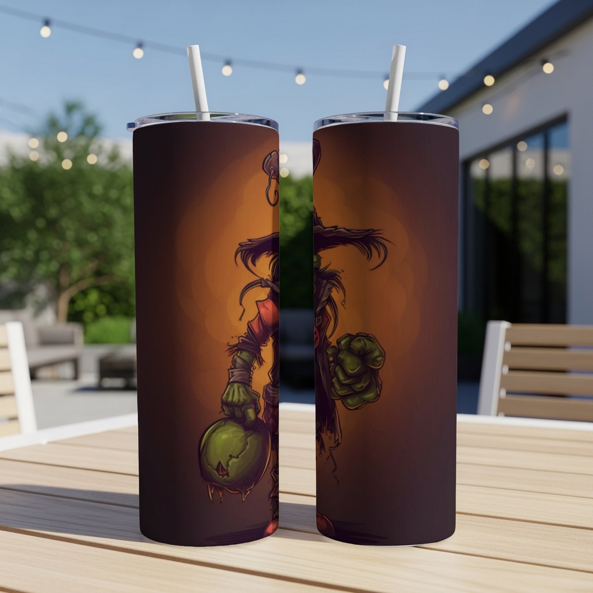 Two tumblers with a cartoon zombie character holding a dripping pumpkin.