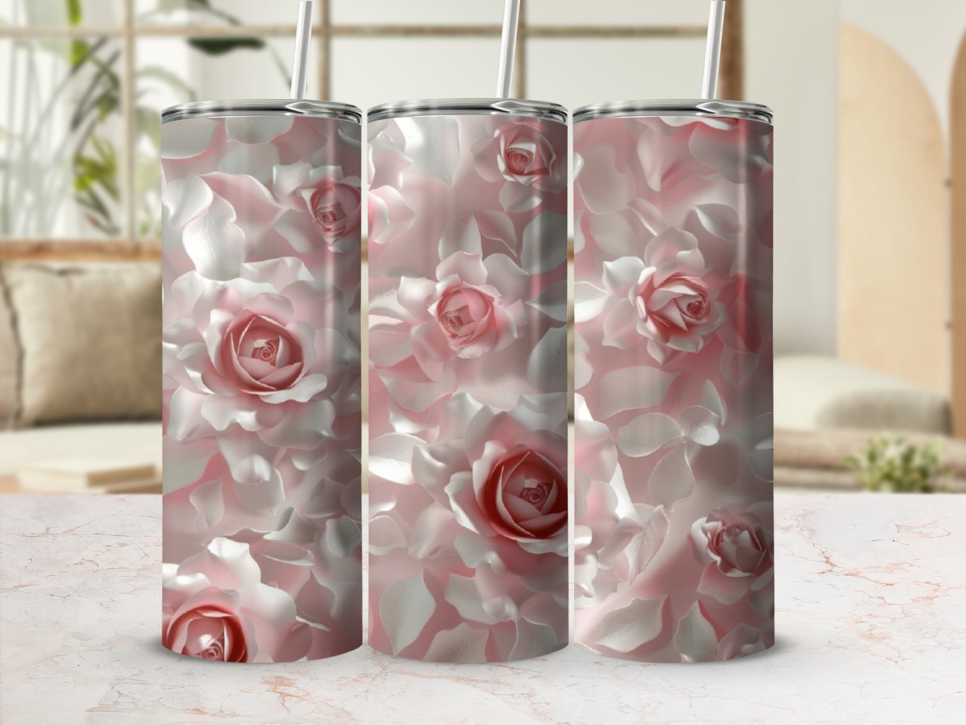 Pink roses pattern on three tall, slender tumblers.