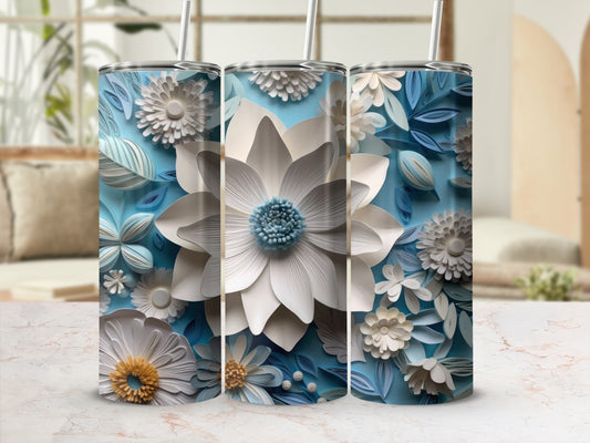 Three paper-cut floral tumblers with blue and white floral patterns.