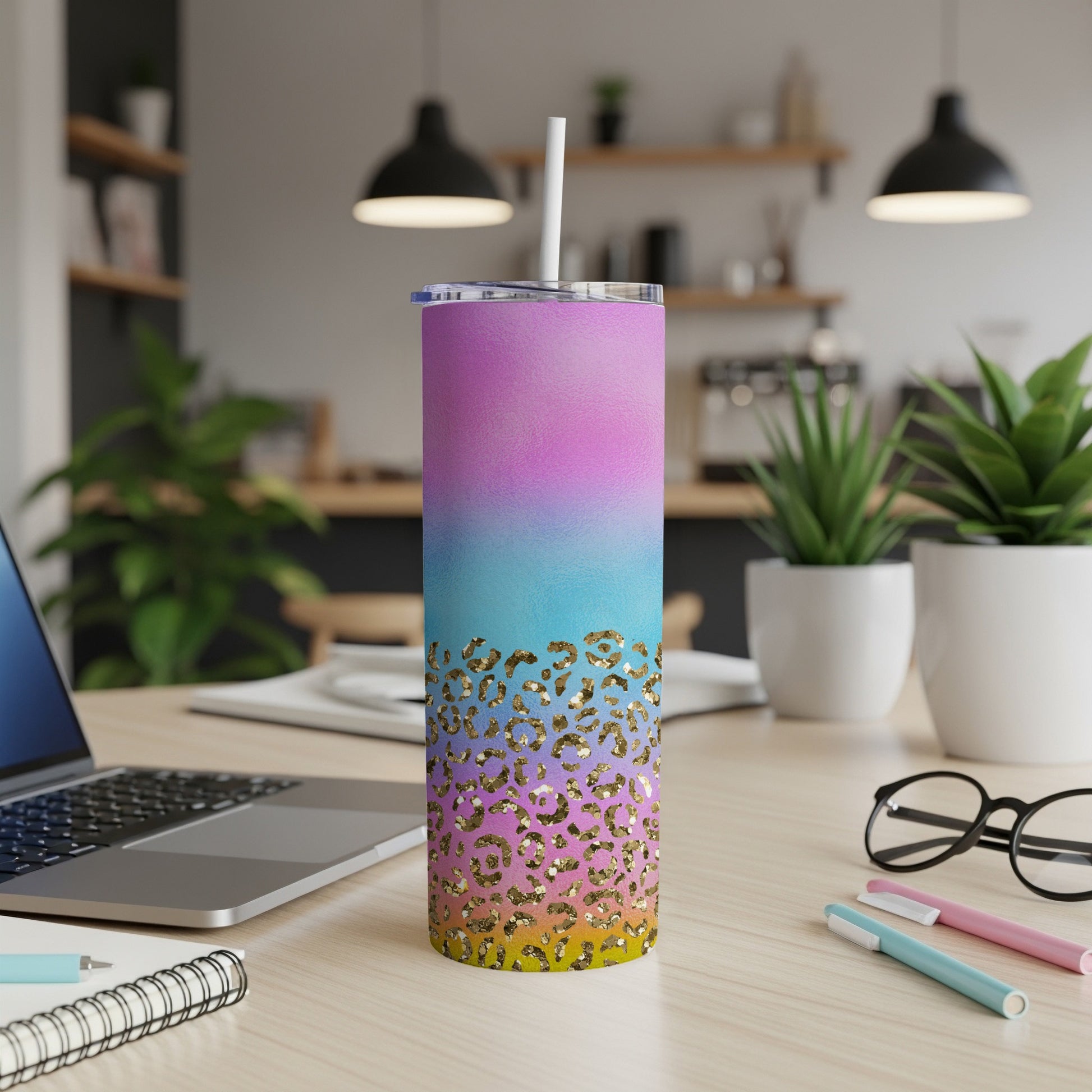Gradient pink, blue, and yellow tumbler with gold leopard print accents.