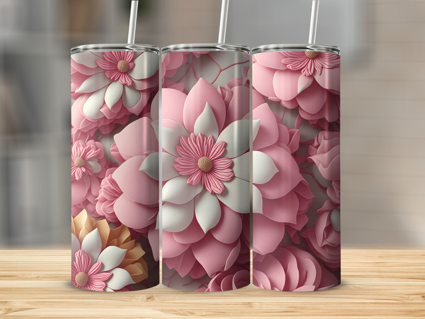 Three tall tumblers with pink and white floral designs.