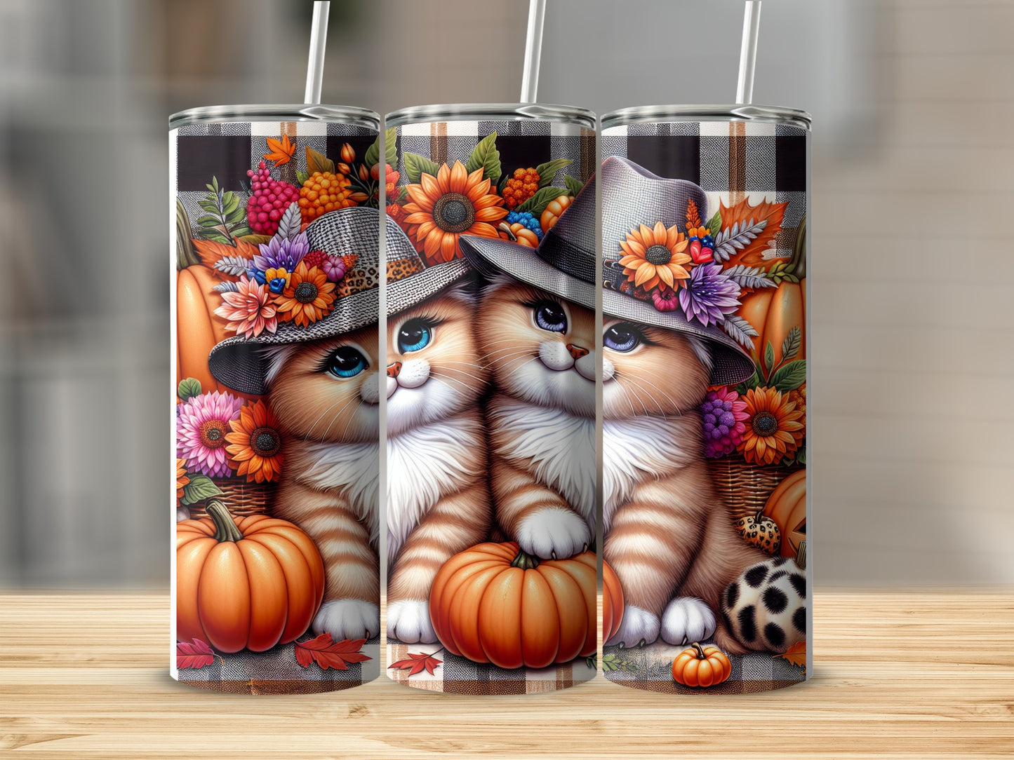 Two cartoon cats in hats and scarves with pumpkins and flowers, on tumblers.