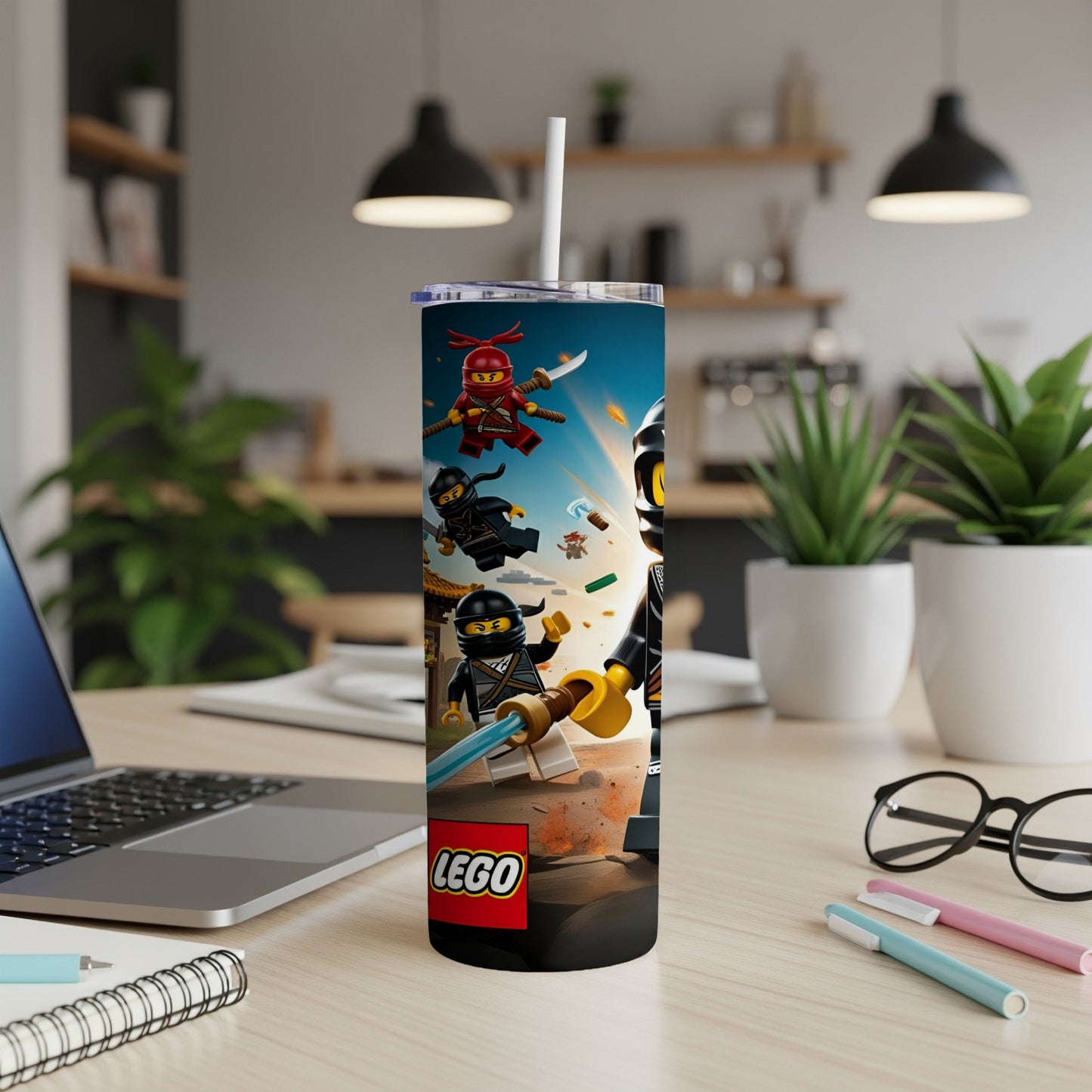 LEGO Ninjago characters on a tumbler with a laptop and office supplies.