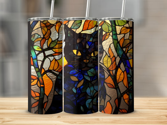 Black cat with yellow eyes peeking through stained glass leaves.