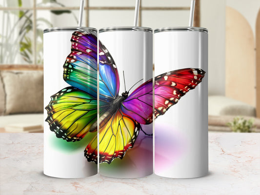 Three tumblers featuring a vibrant, colorful butterfly design.
