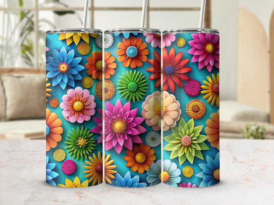 Three blue tumblers with colorful floral patterns.