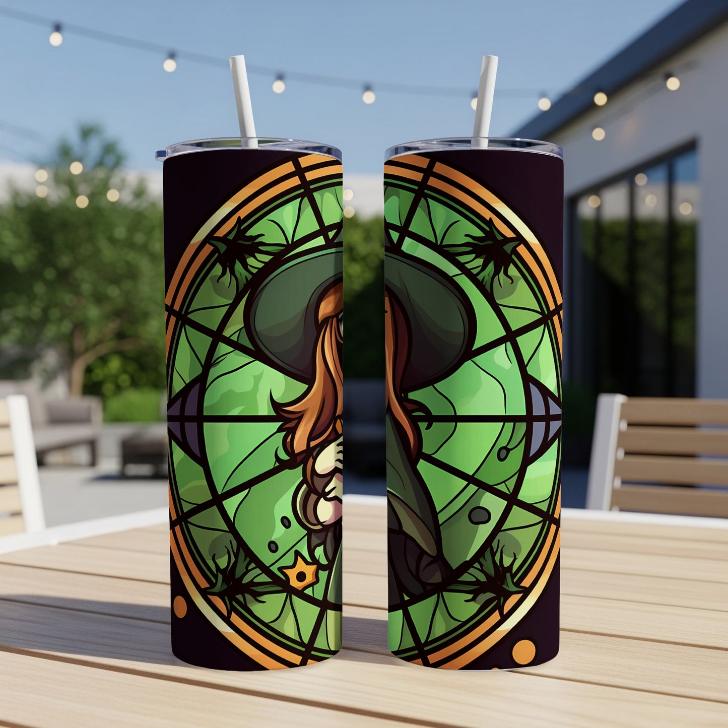Two tumblers with stained-glass witch design in green and orange hues.