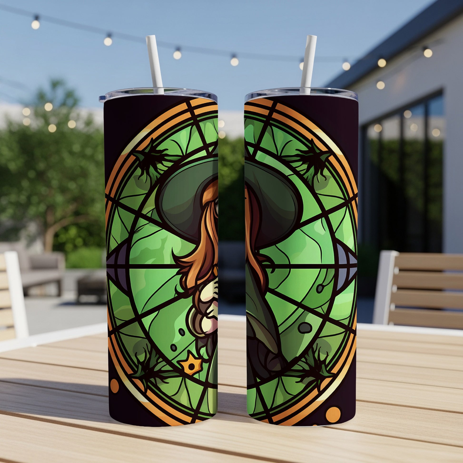 Two tumblers with stained-glass witch design in green and orange hues.
