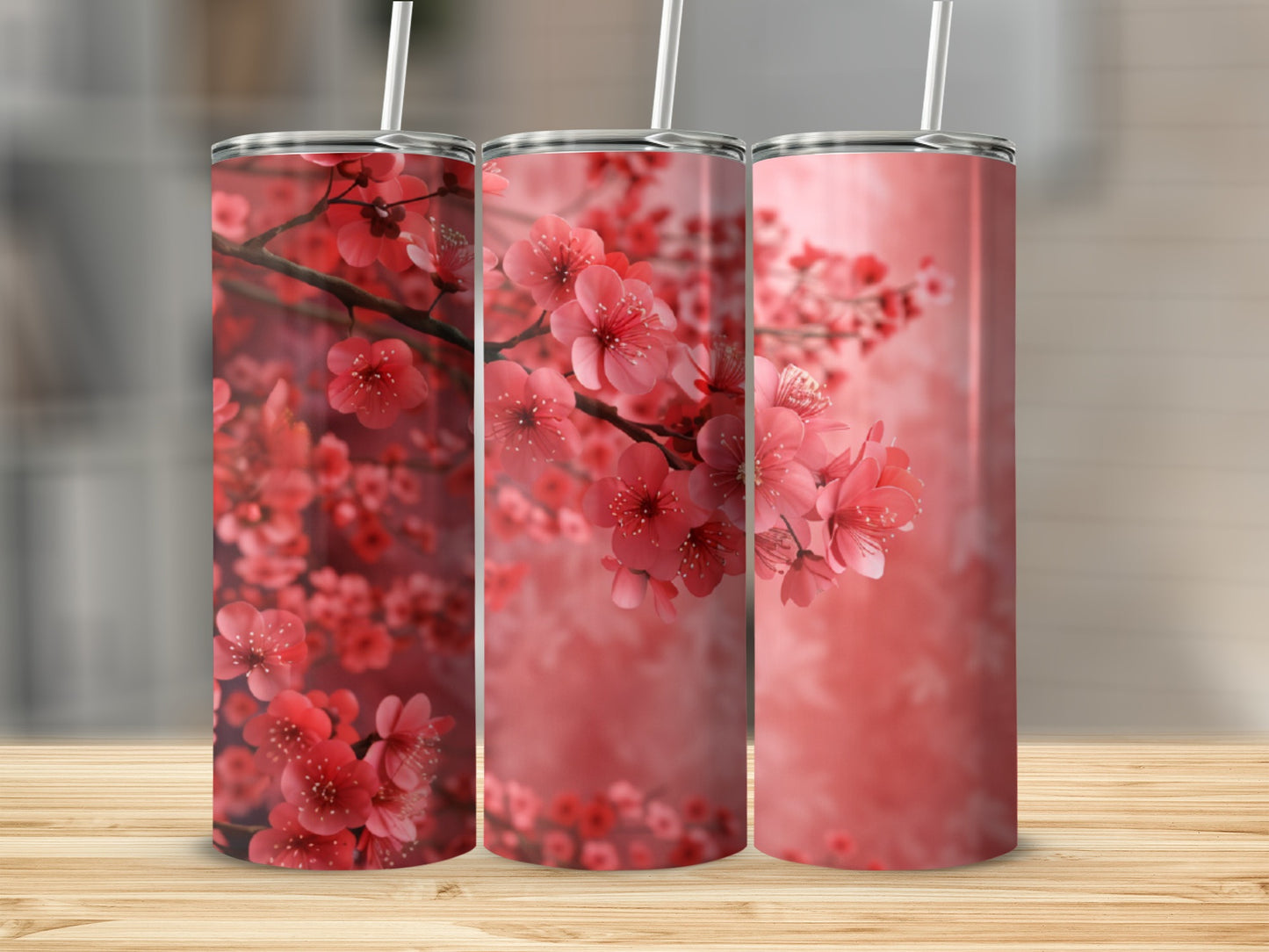 Three tumblers with a pink cherry blossom floral design.