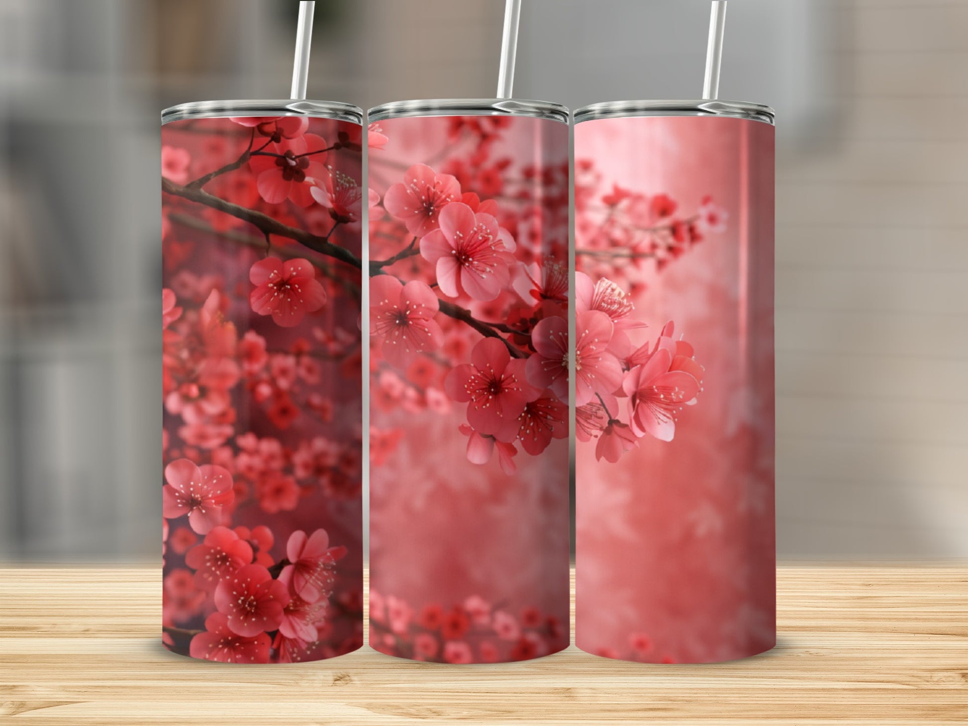 Three tumblers with a pink cherry blossom floral design.