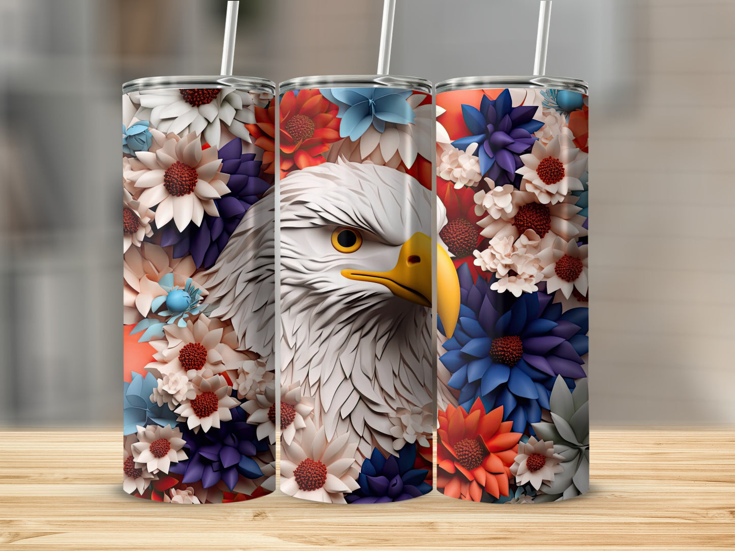 Eagle's head with patriotic floral patterns on three tumblers.