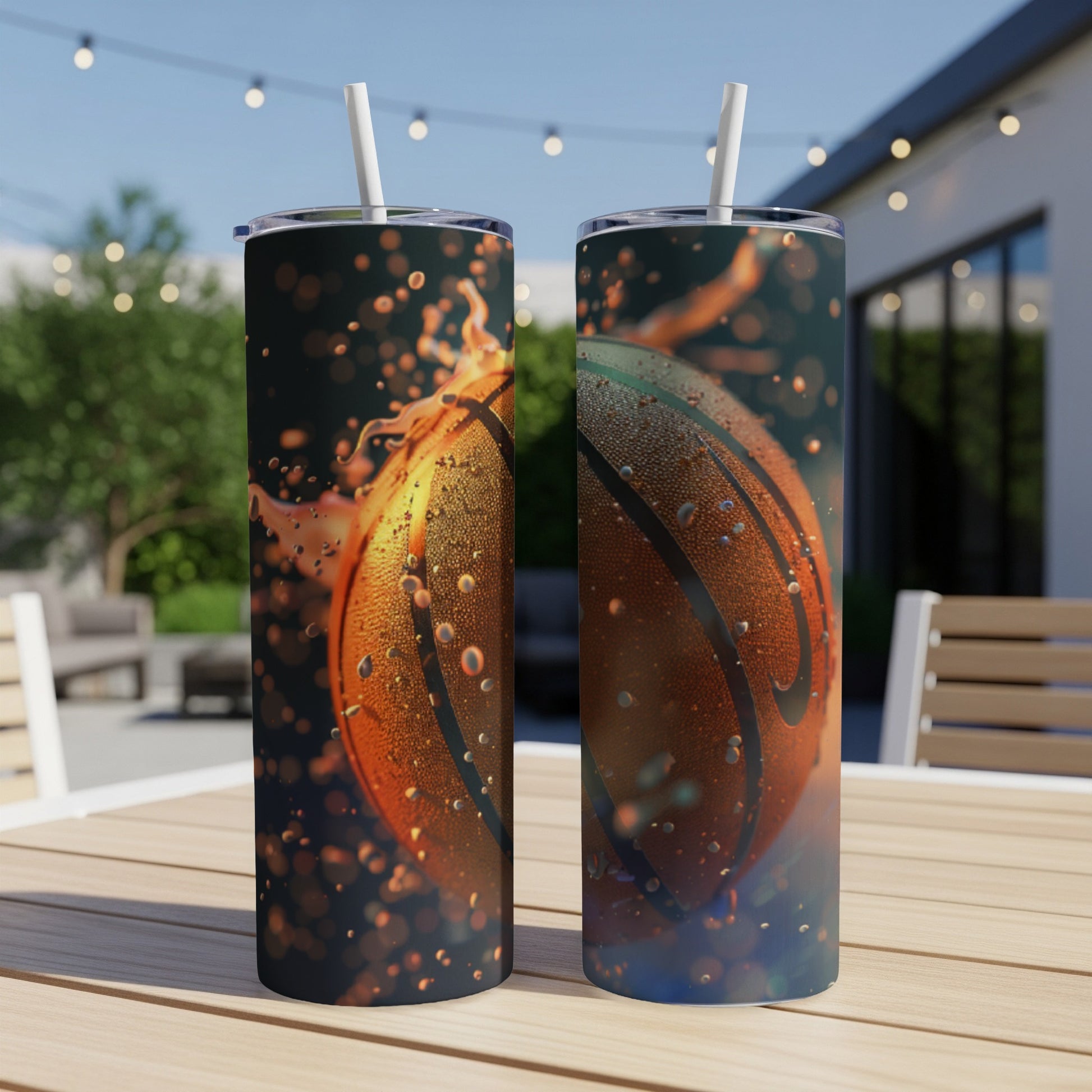 Two skinny tumblers with basketball graphic and water droplets.