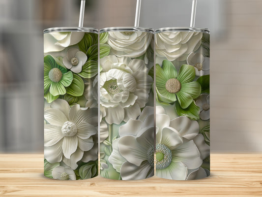 Three white tumblers with embossed white and green floral patterns.