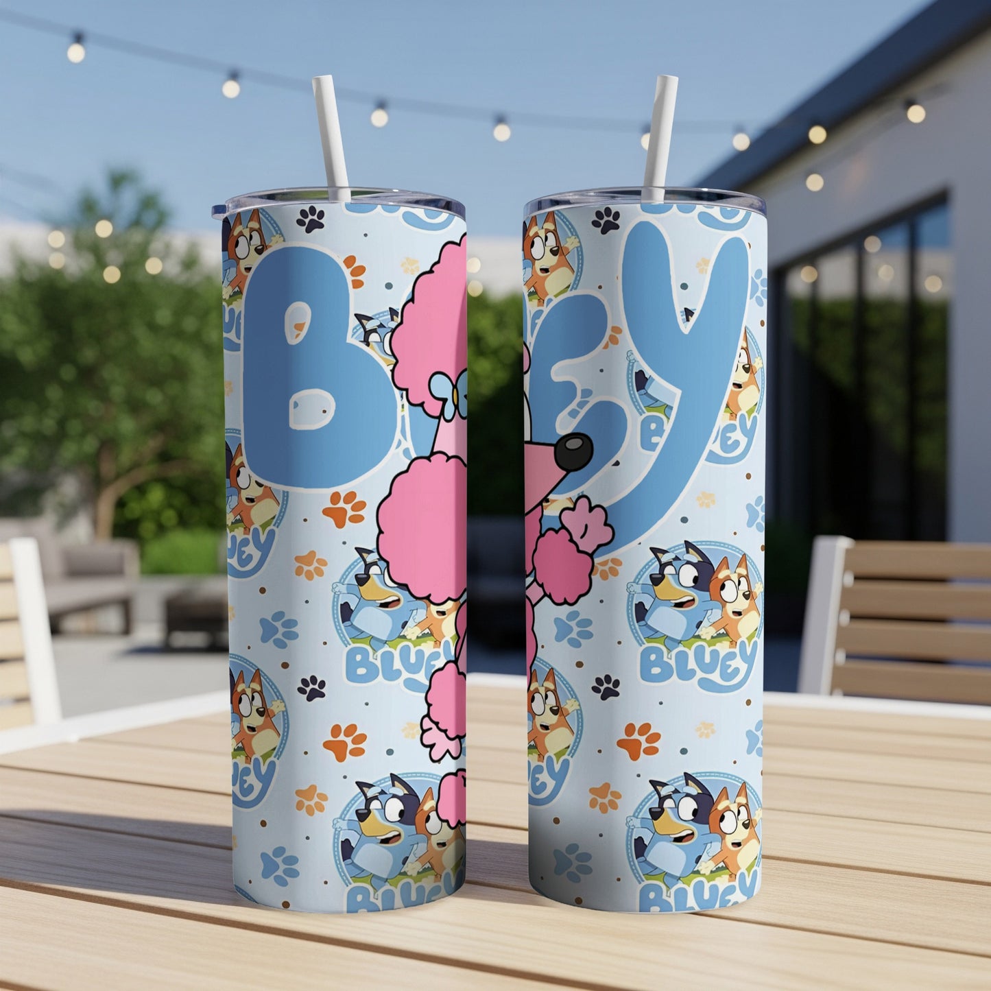 Bluey and Bingo character pattern on two blue stainless steel tumblers.