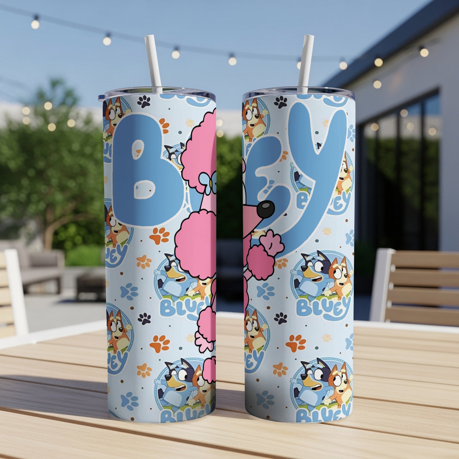 Bluey and Bingo character pattern on two blue stainless steel tumblers.
