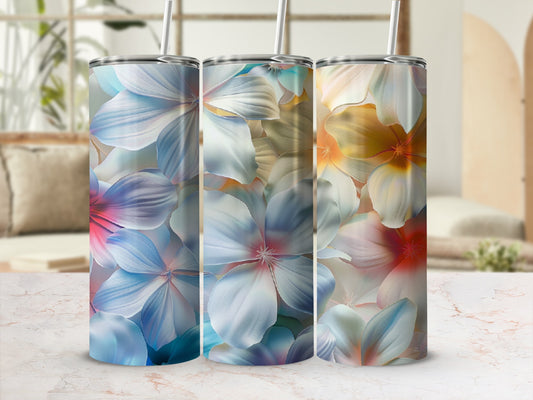 Three tumblers with floral patterns in blue, pink, and yellow.