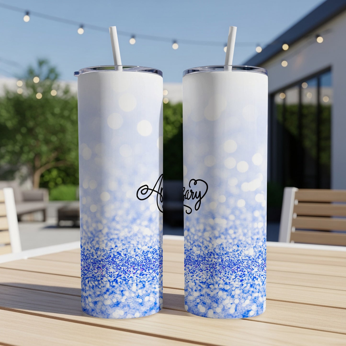 Two tall tumblers with blue glitter and bokeh effect, text "Anniversary" on one.