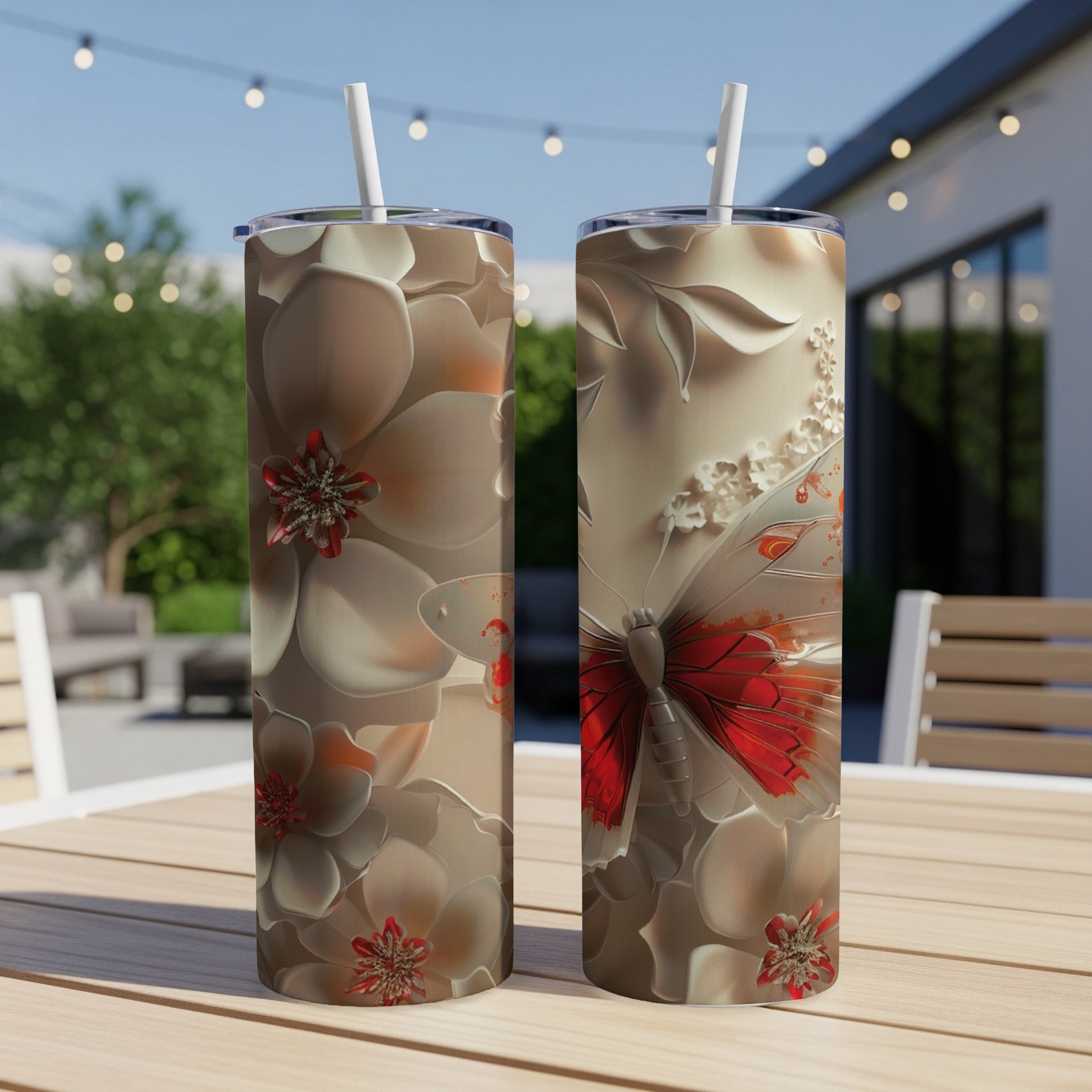 Two tumblers with a detailed floral and butterfly design.