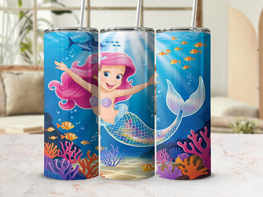 Cartoon mermaid with pink hair swimming underwater with fish and coral.