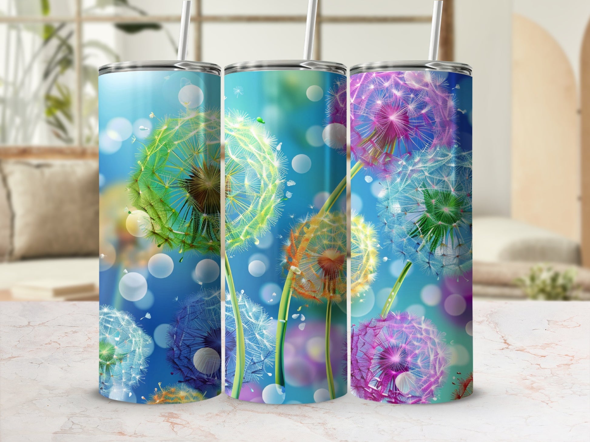 Three tumblers with colorful dandelion designs and bokeh background.
