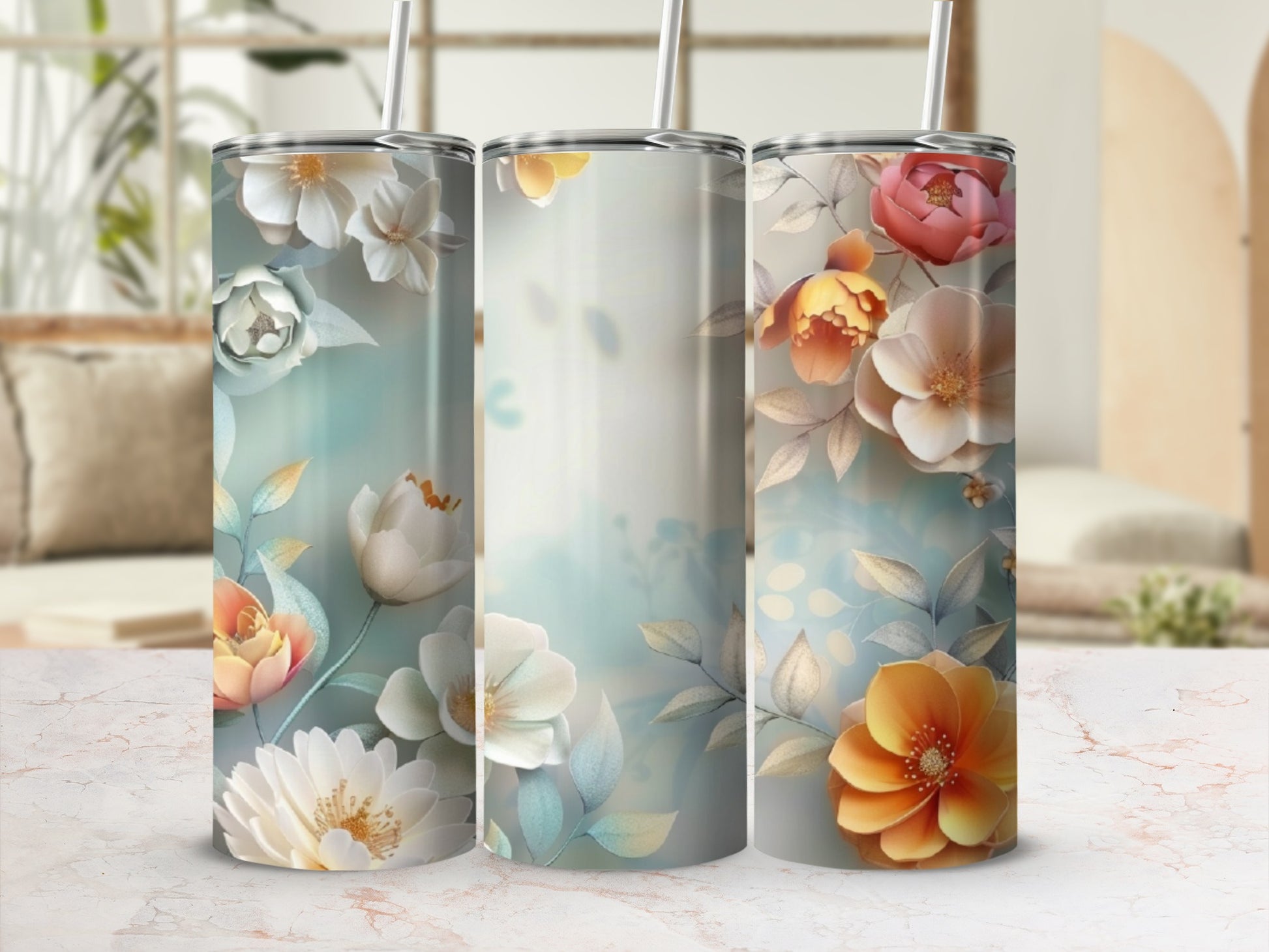 Three tall tumblers with floral designs and muted background colors.