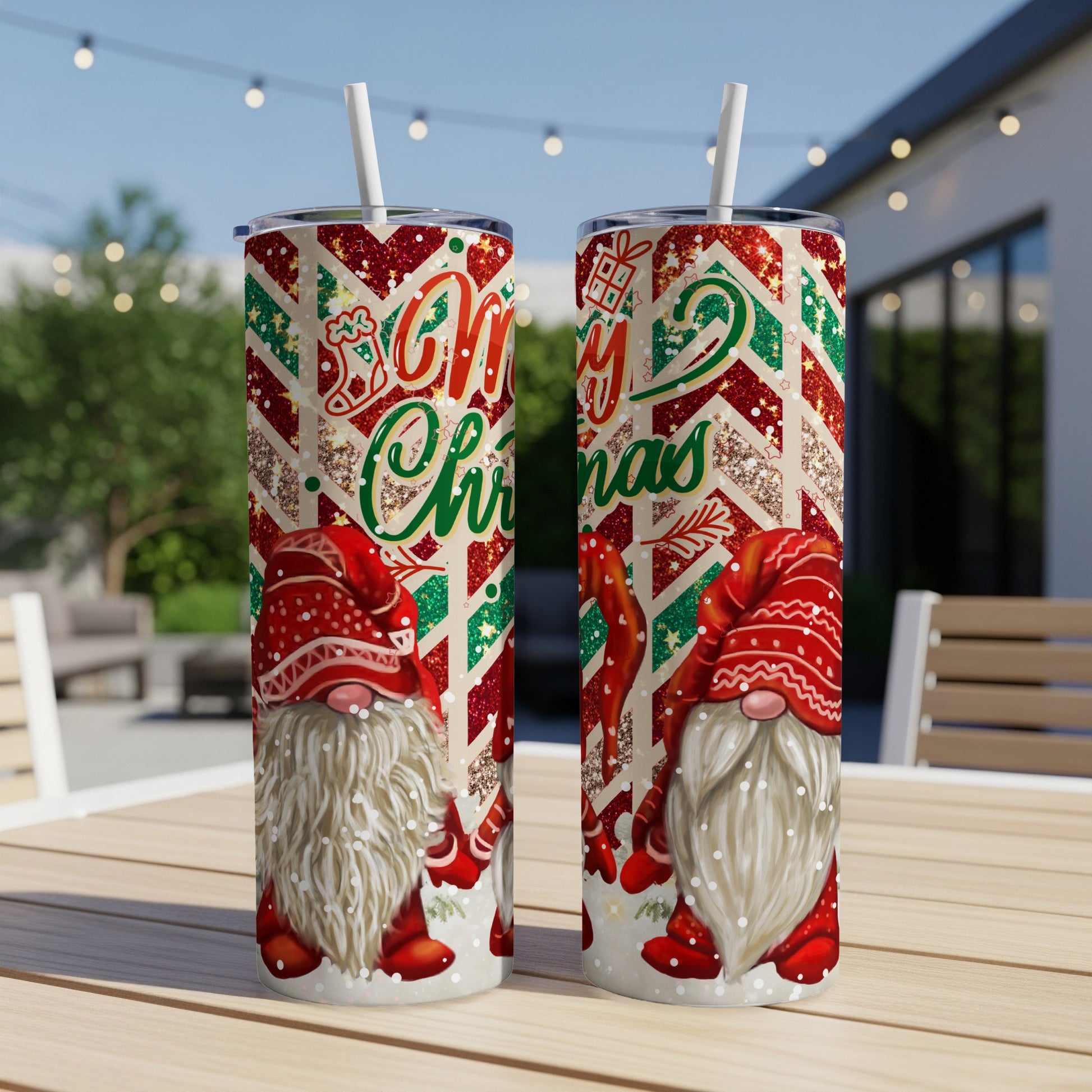 Two Christmas gnomes on patterned tumblers with "Merry Christmas" text.