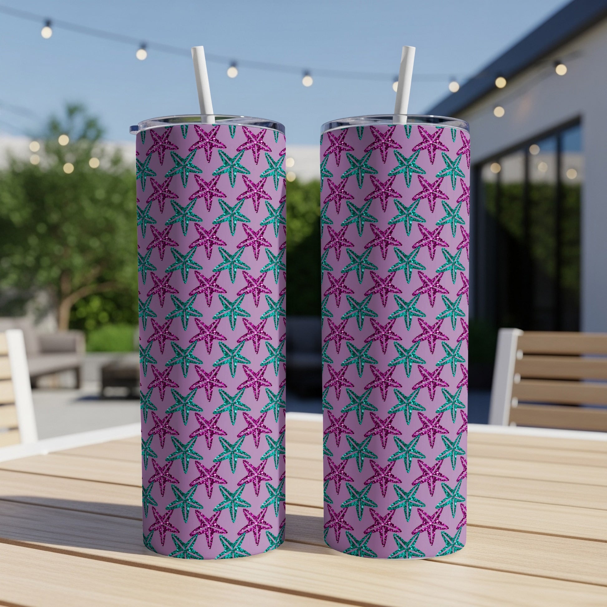 Two tumblers with a purple background and a pattern of pink and teal glittery starfish.