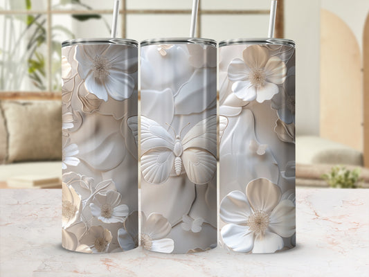 Three tall tumblers with embossed floral and butterfly designs, with straws.