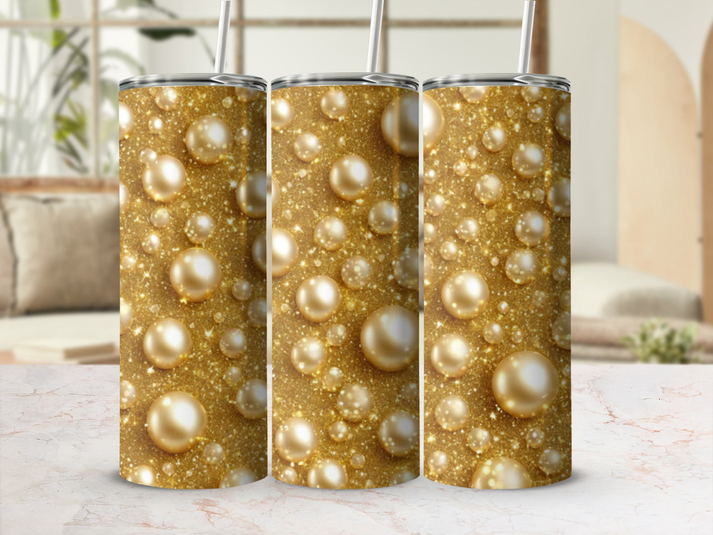 Gold glitter and pearl pattern on three identical tumblers.