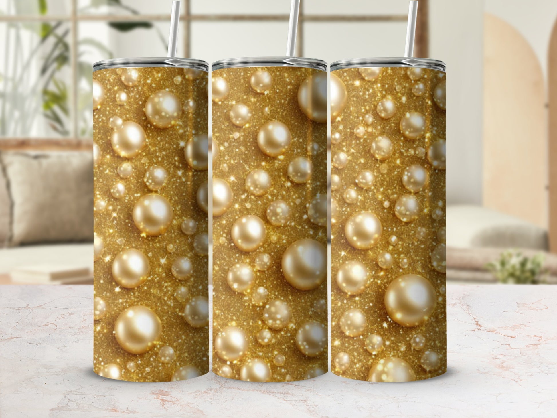 Gold glitter and pearl pattern on three identical tumblers.