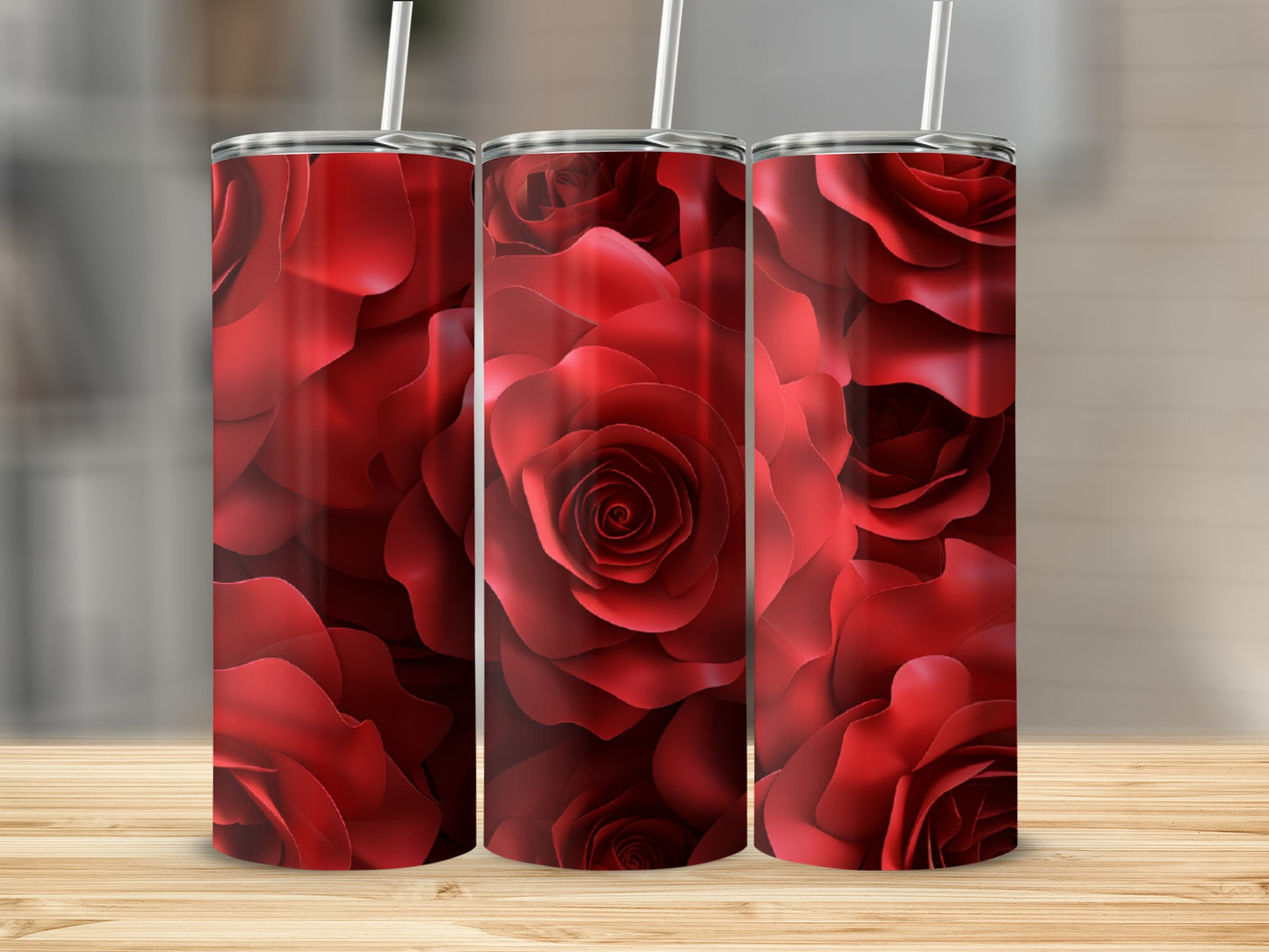 Three tumblers with a repeating pattern of red roses.
