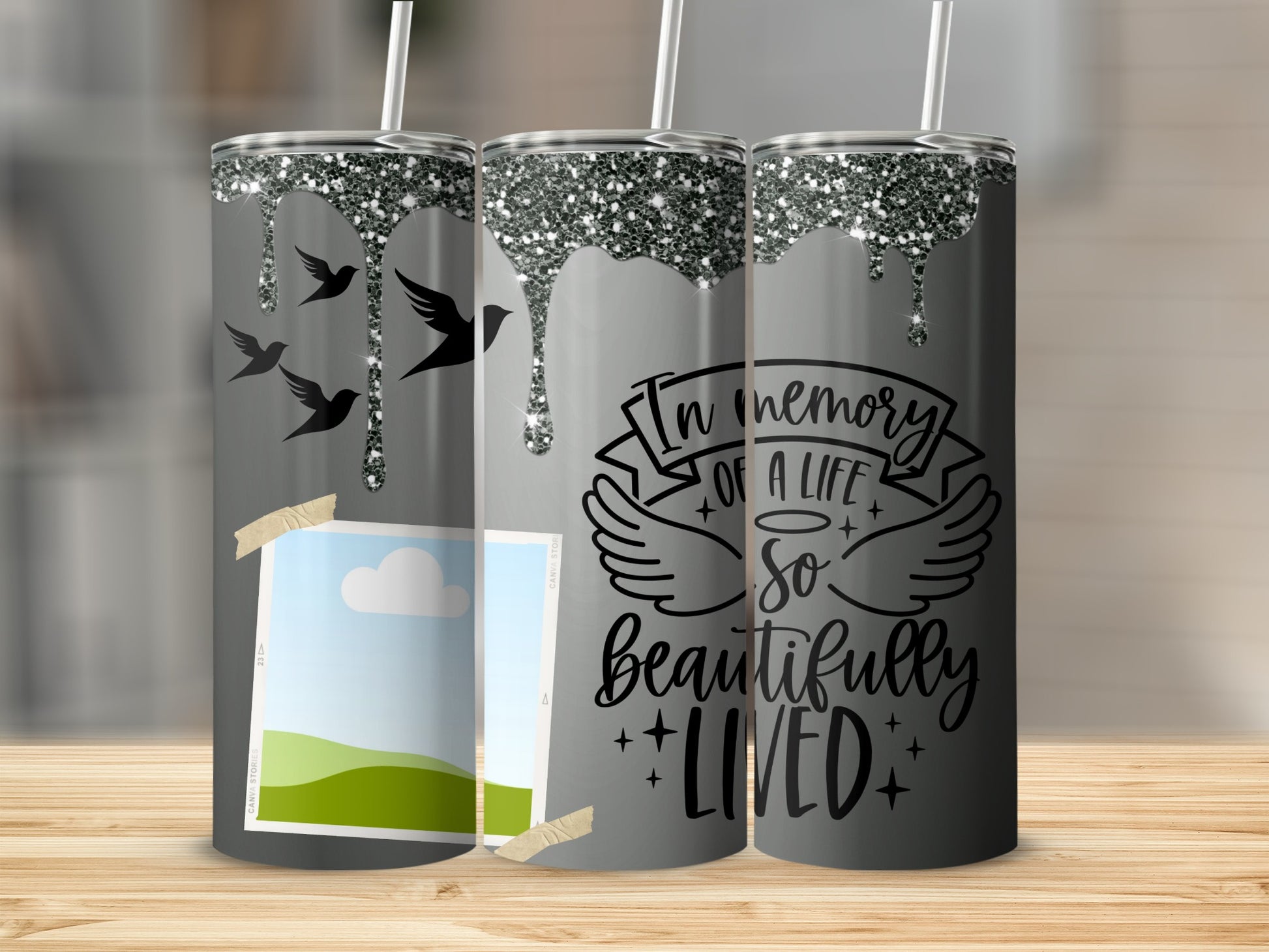 Gray tumbler with glitter drip, birds, photo placeholder, and "In memory of a life so beautifully lived" text.