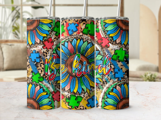 Sunflower and puzzle pieces tumbler with "Be Kind" text.
