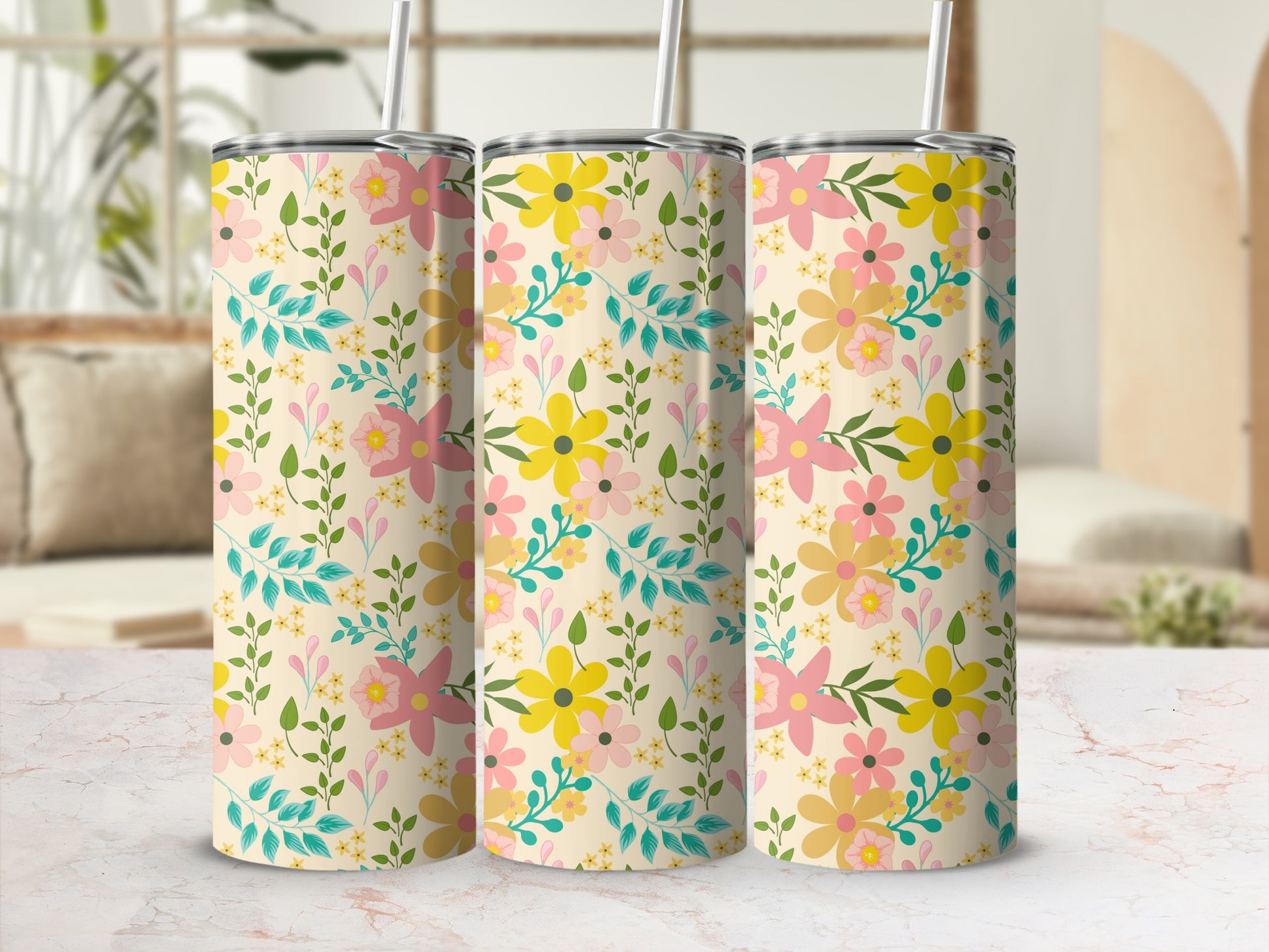 Three tumblers with a cream background and a scattered floral and leaf pattern.
