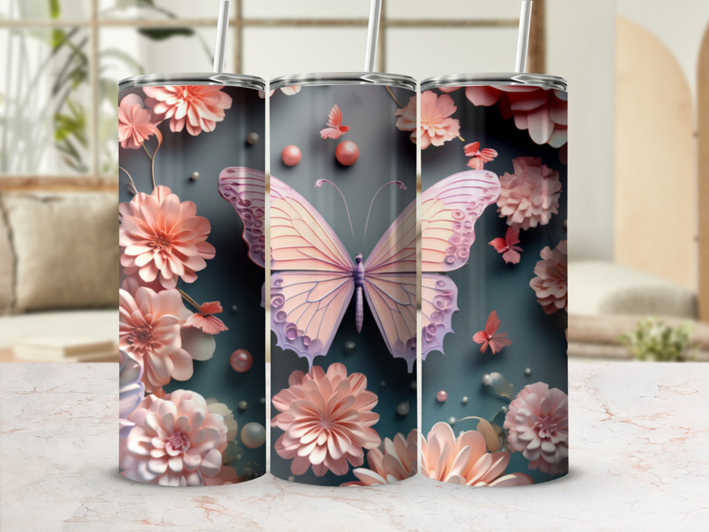 Pink butterflies and flowers adorn three stainless steel tumblers.