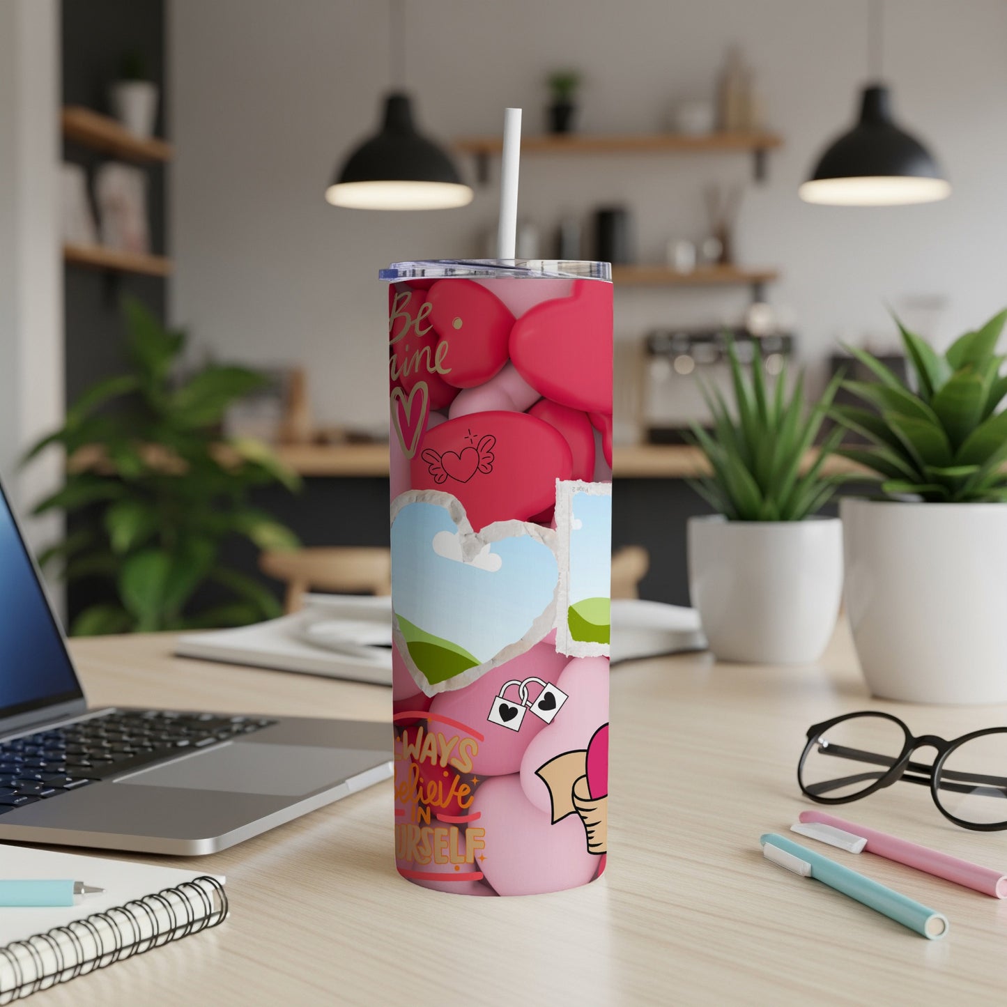 Pink tumbler with scattered hearts, clouds, and text "Always Believe In Yourself."