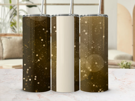 Three glitter tumblers with straw on a marble surface.