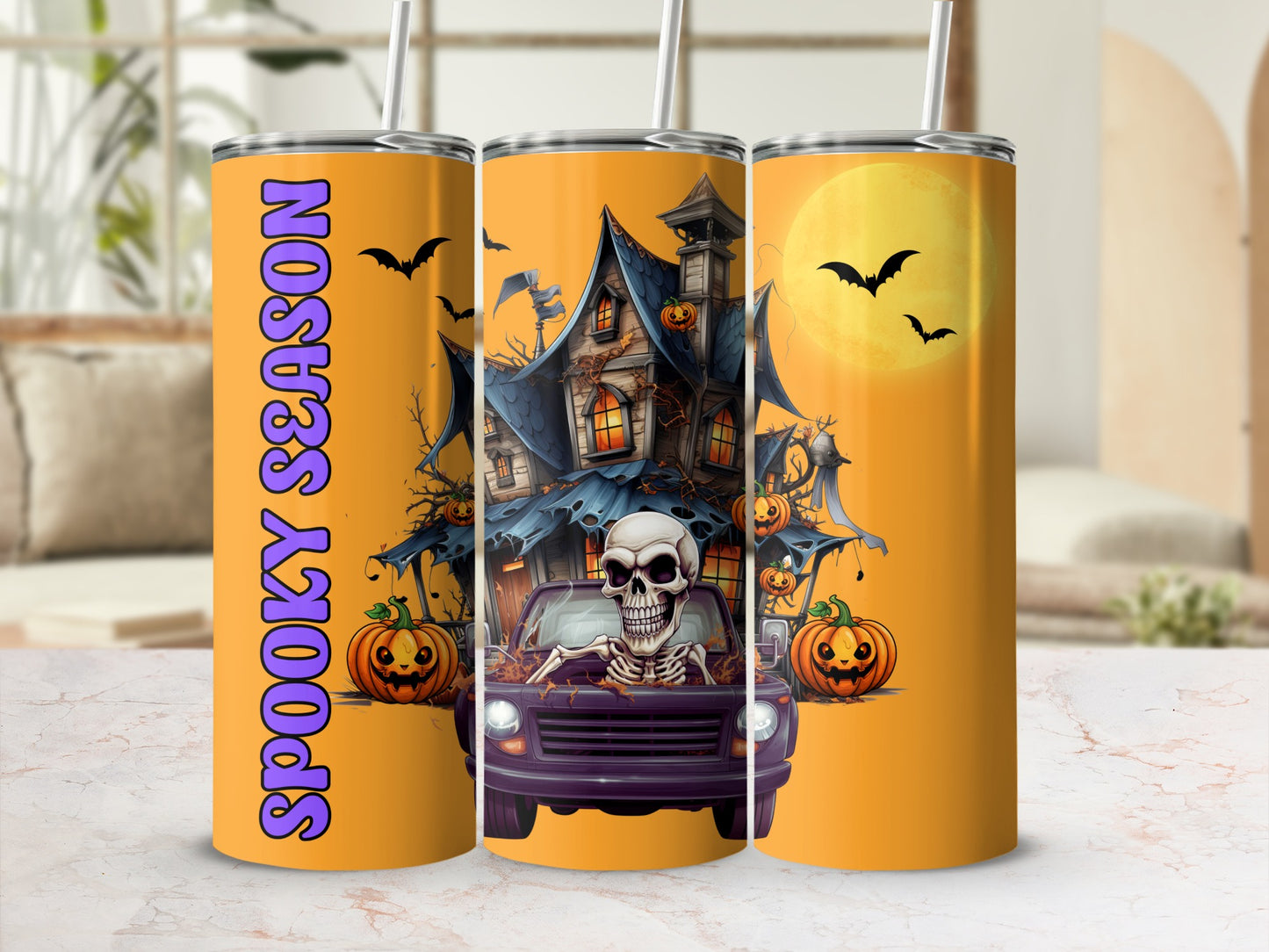 Halloween tumbler with skeleton, haunted house, pumpkins, bats, and "Spooky Season" text.