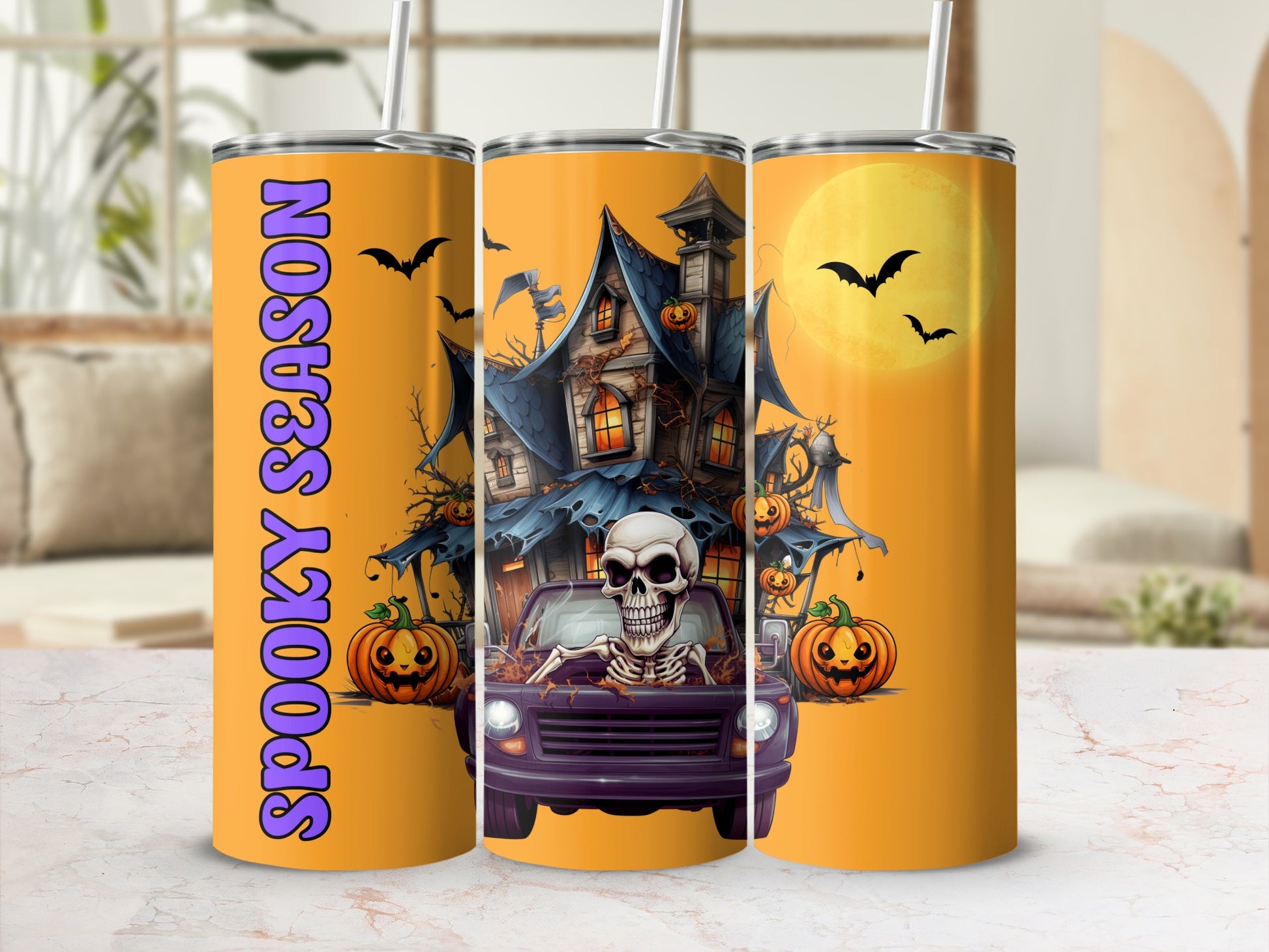 Halloween tumbler with skeleton, haunted house, pumpkins, bats, and "Spooky Season" text.