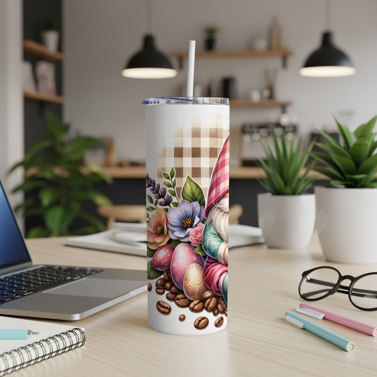 Gnome with Easter eggs and coffee beans on a patterned tumbler.