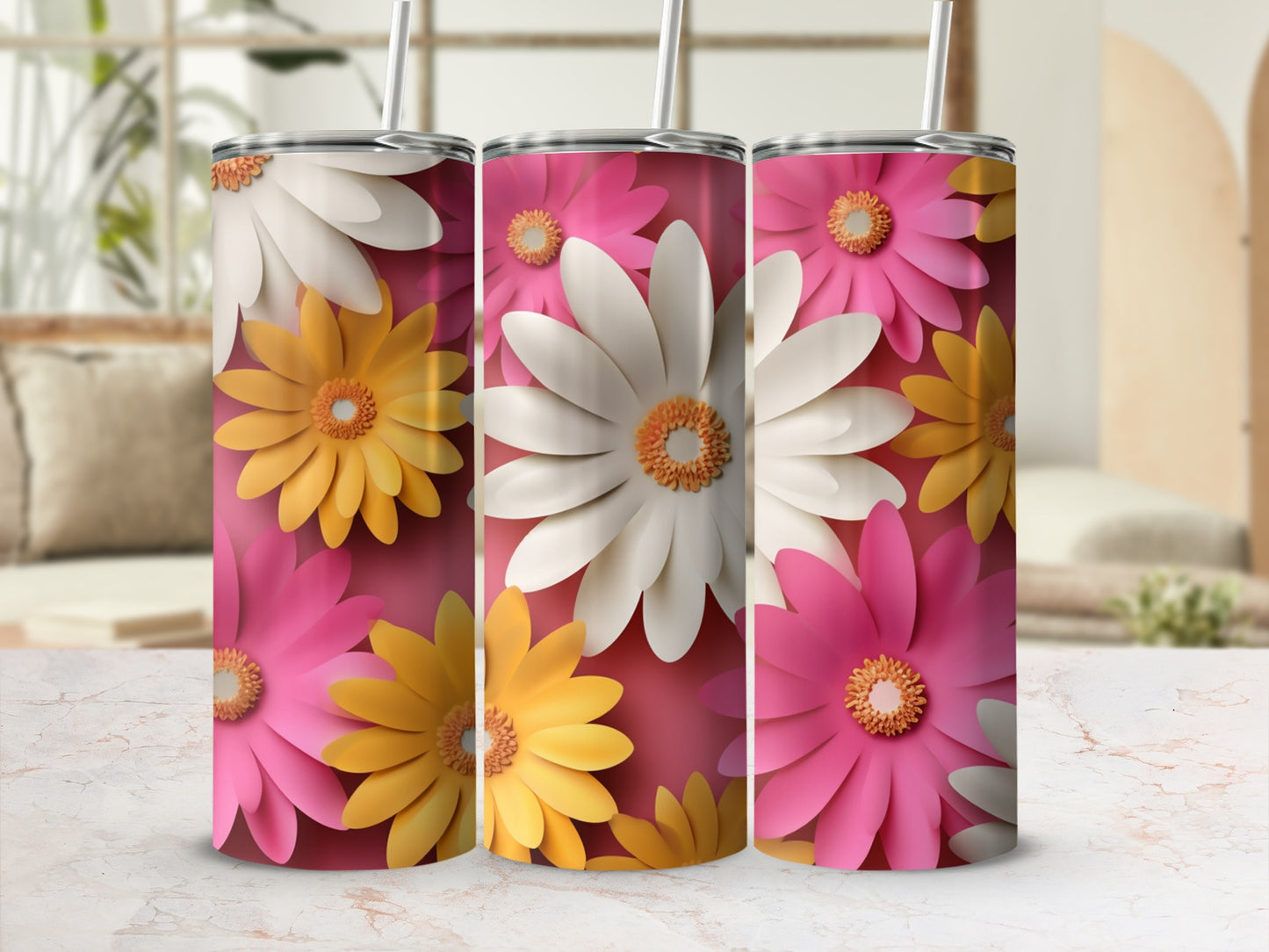 Three tumblers with floral patterns in pink, yellow, and white.