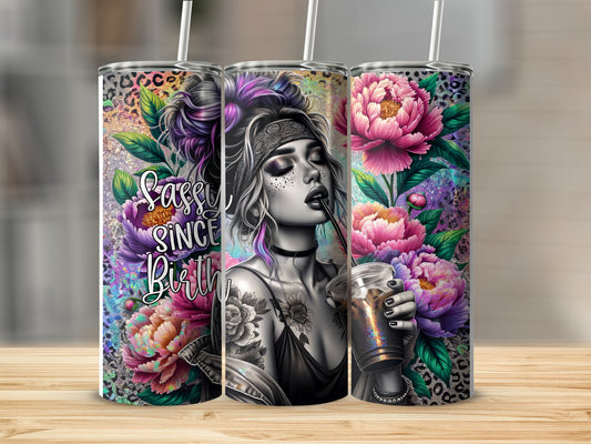 Tumbler with woman and floral design, "Sassy Since Birth" text.