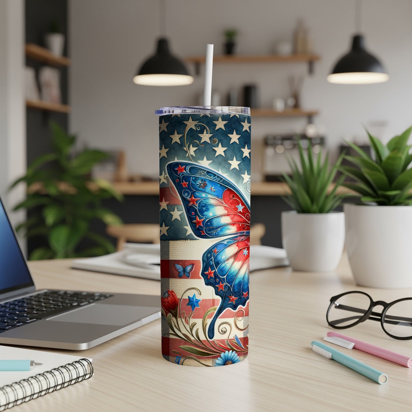 American flag butterfly design on a white tumbler with straw.