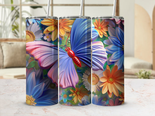 Three tumblers with floral and butterfly designs displayed on a marble surface.