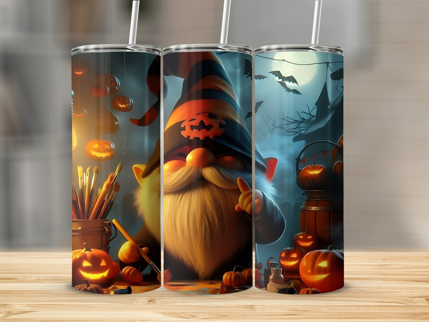 Three tumblers with a Halloween theme featuring a gnome, pumpkins, and bats.