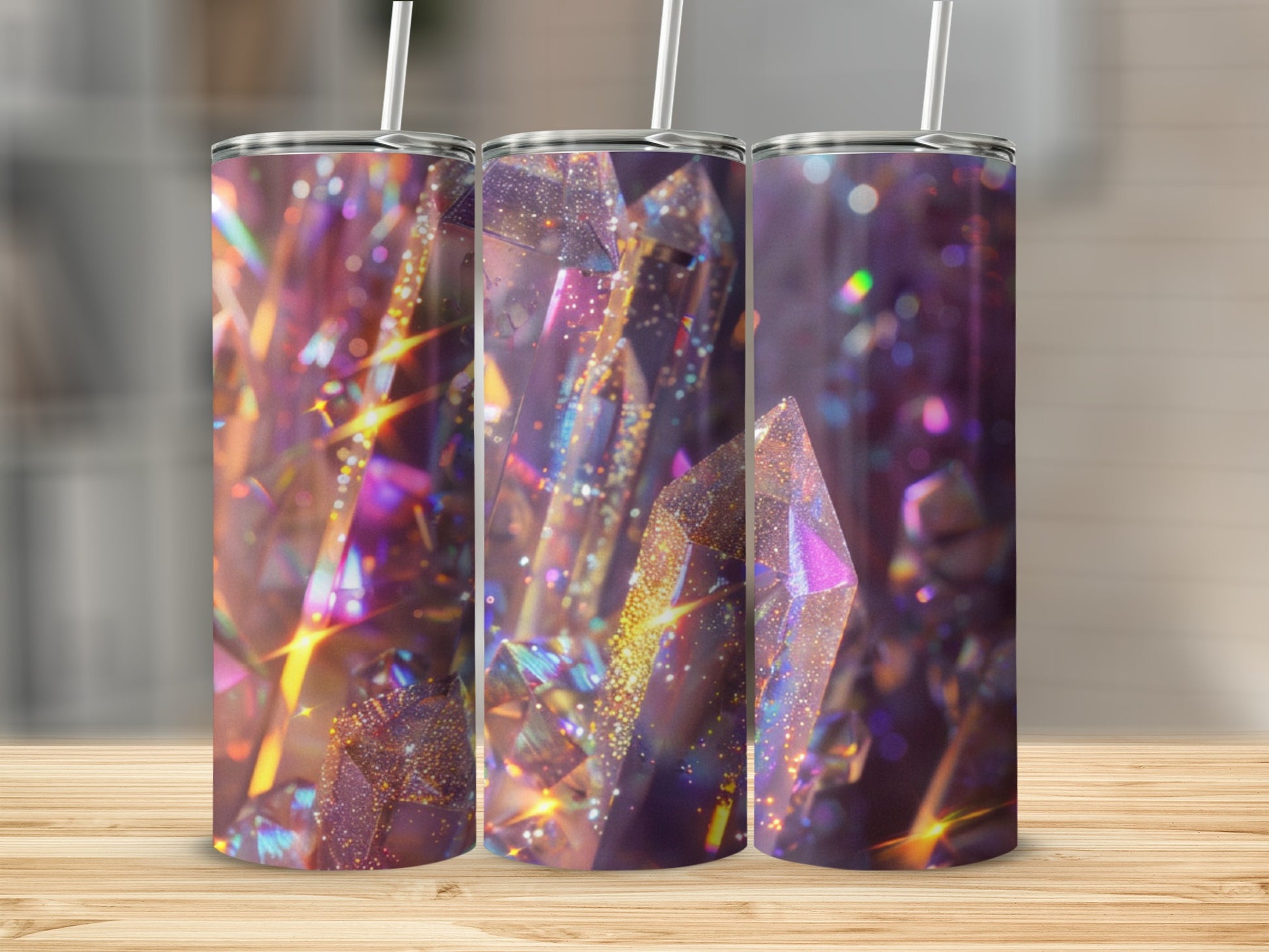 Three tumblers with a glittering, iridescent crystal design and straws.